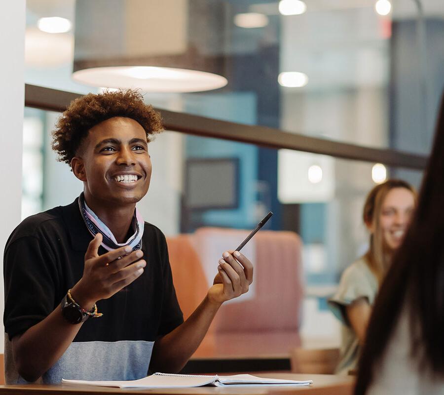 Education student engages in classroom discussion.